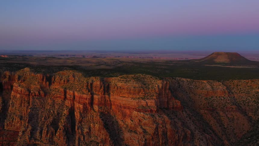 A canyon with the sky in the background
