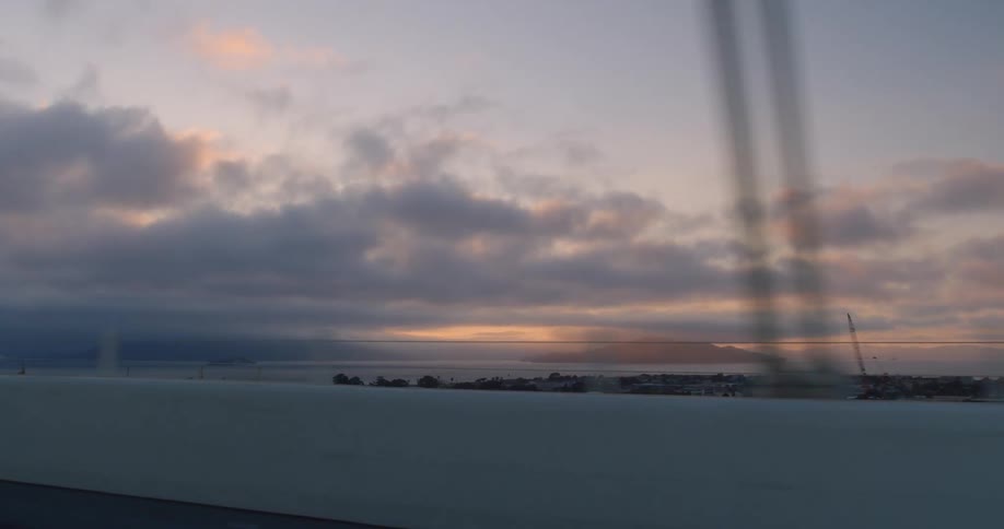 Driving over a bridge and looking at the coast and ocean