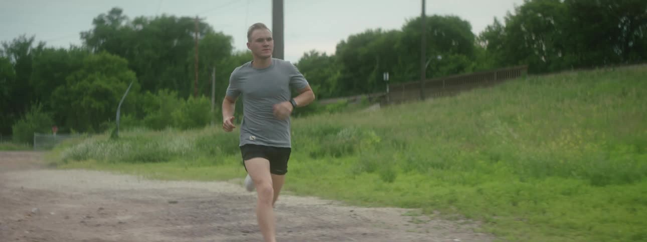 Man running down a street