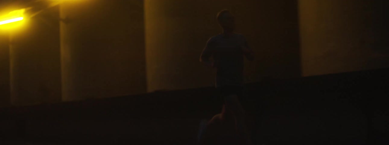 The man runs down the street