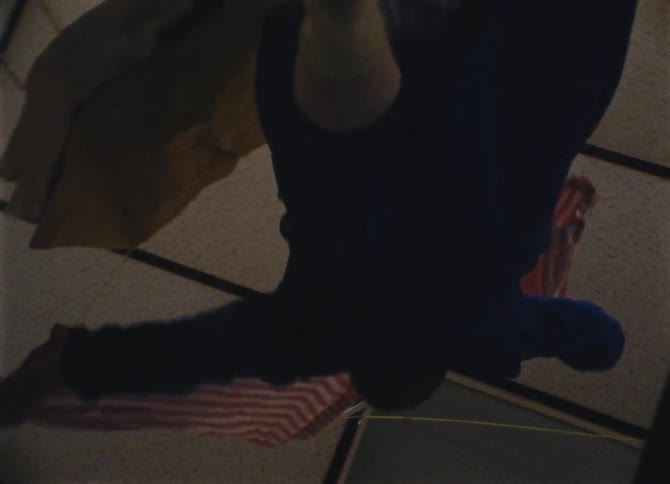 Woman grabs a flag and twirls around