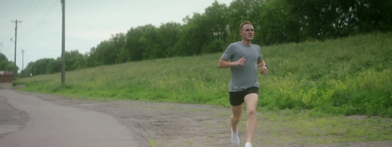 Man runs down small rural road