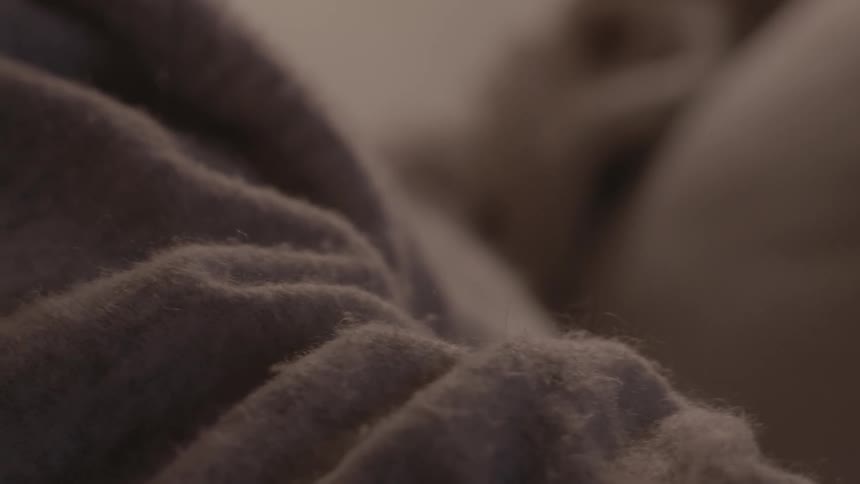 Close view of folds and texture of womans sweater