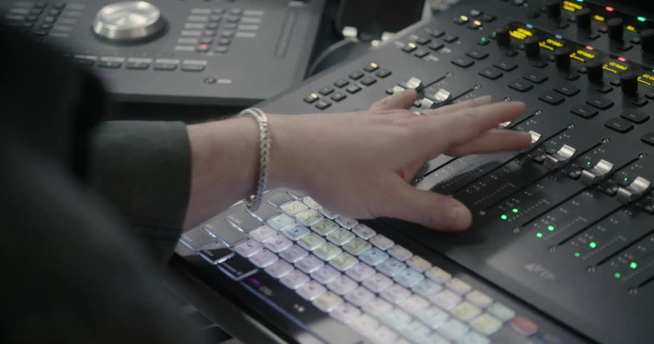 Person using sound mixing equipment
