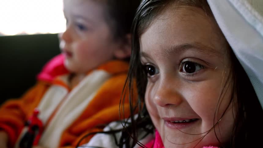 Two young toddlers sitting together