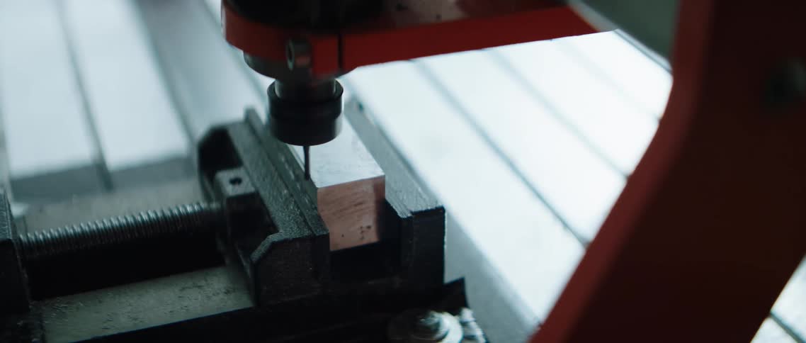 Jig saw cutting through small wood block in vice grip