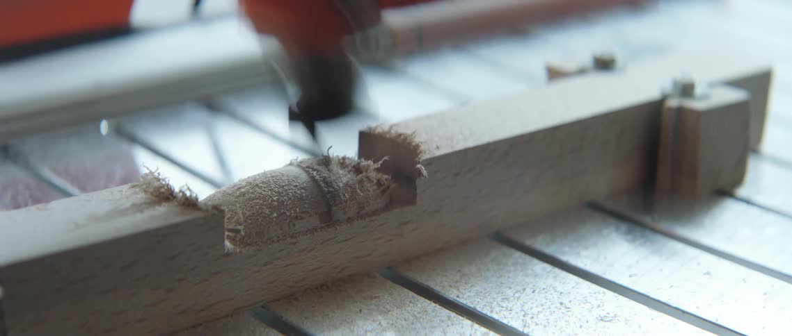 A machine etches and smoothes out a section of wood