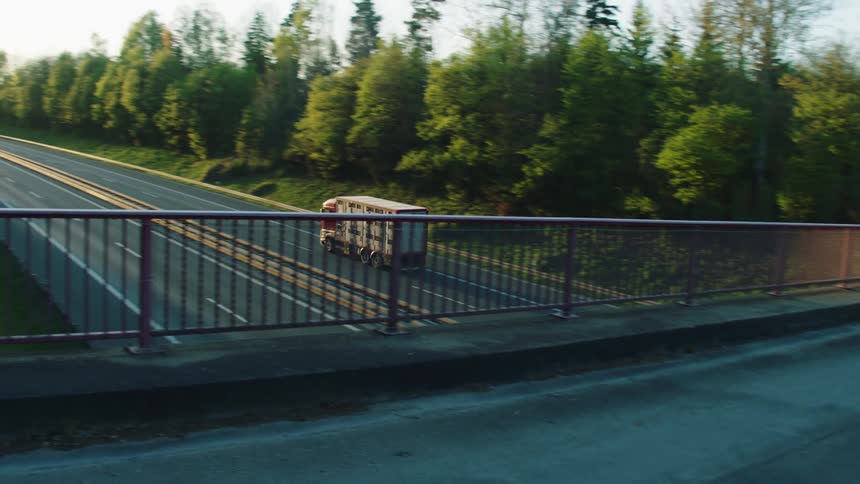 The truck drives down the road