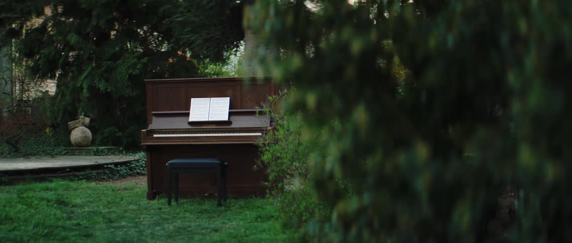 The piano sits outside