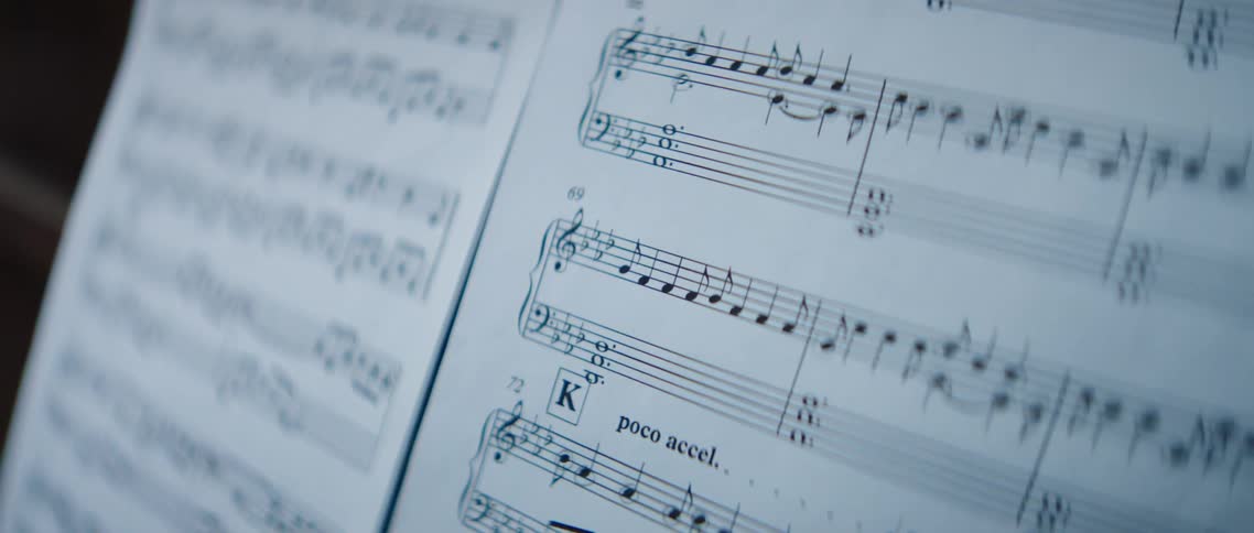 Music notes cover a sheet of music