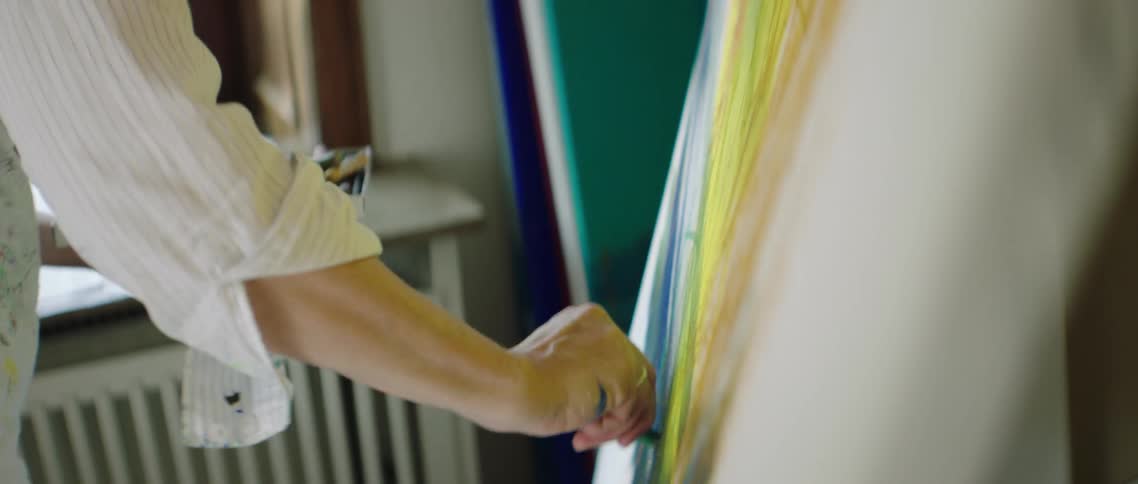 A woman draws on paper