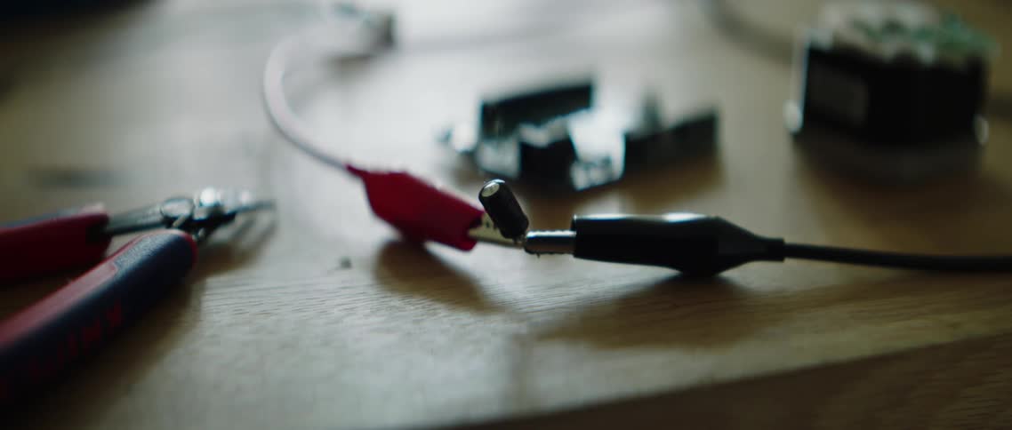 Smoke rises from two wires welded together