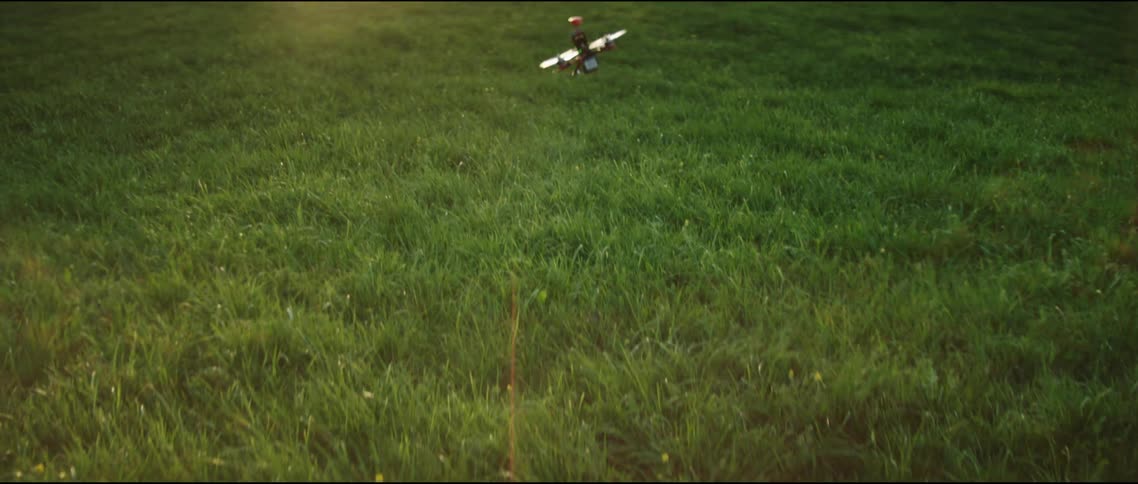 Small drone flying around field