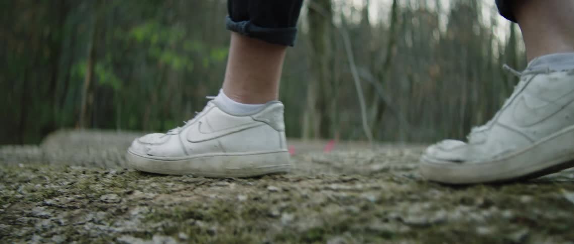 A person walks through the forest