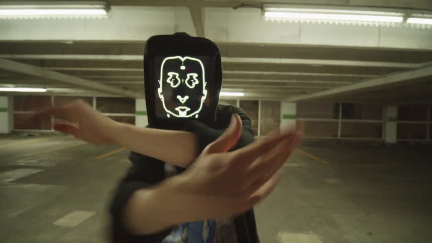 A person wearing a rectangular mask dancing