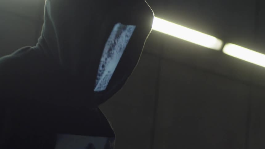 A teenager with a screen over his face dances