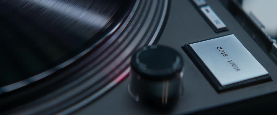A record plays on a turn table
