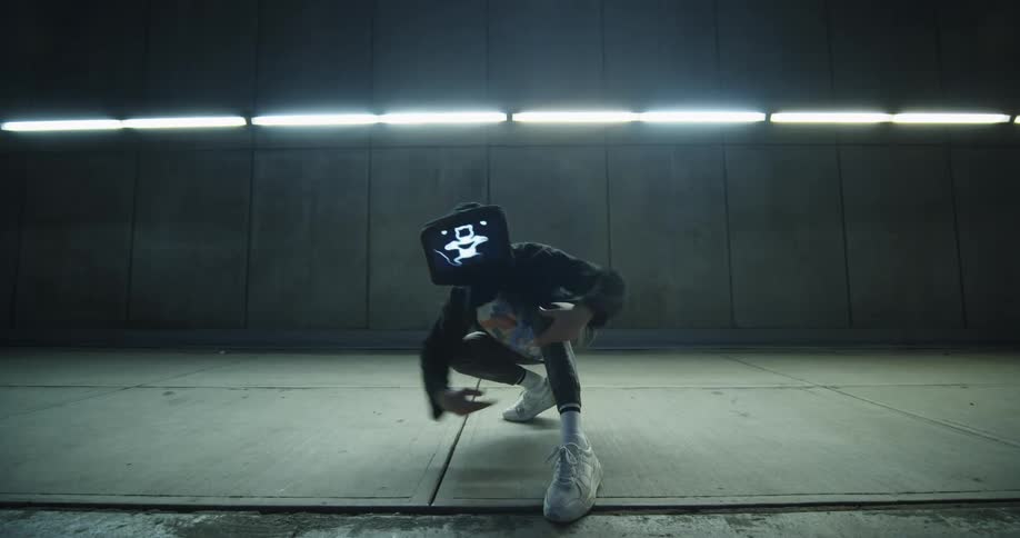 A dancer with a mask on performs