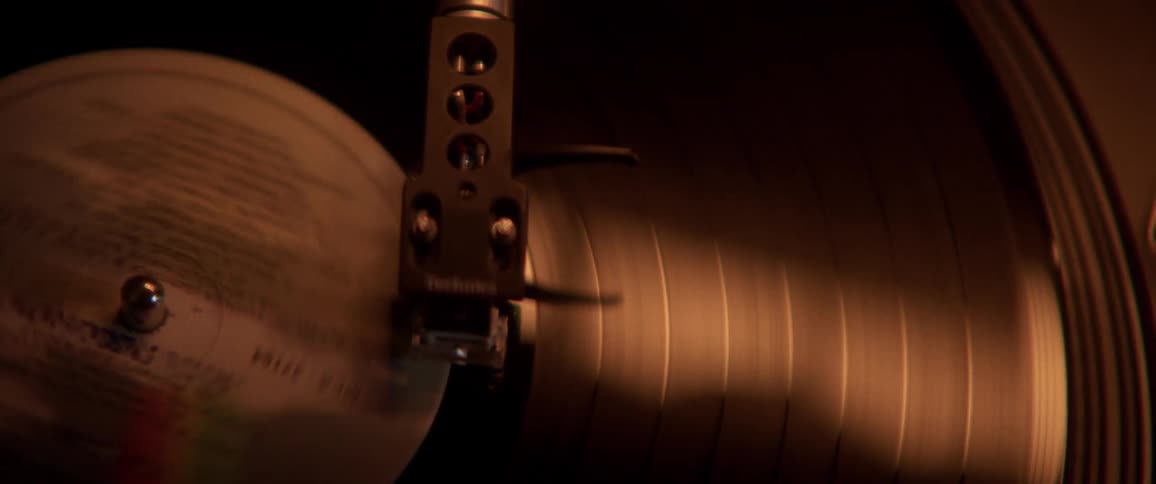 A record album spins on a record player