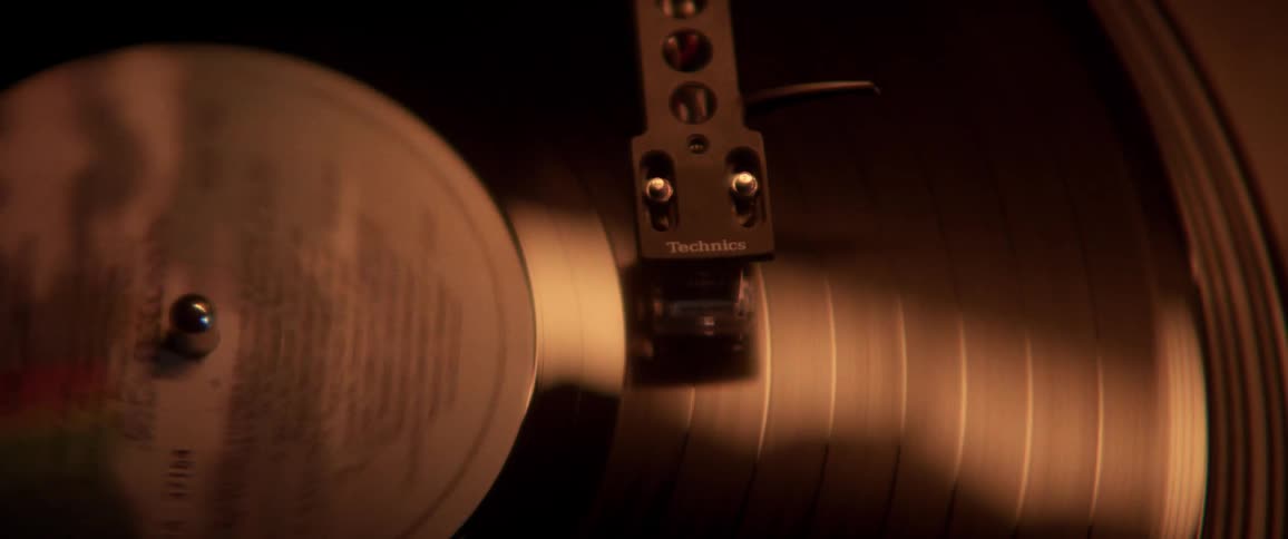 A vinyl record spinning atop a record player