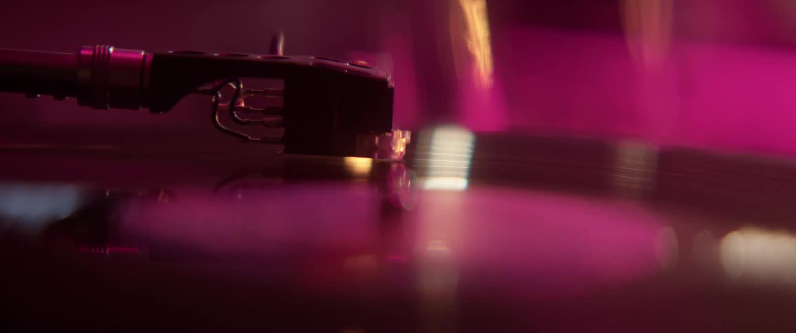 Record player needle on spinning record