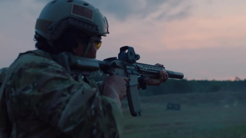 The soldier fires their gun