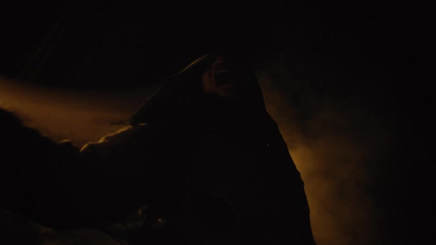 A person wrapped in a costume tries to get out