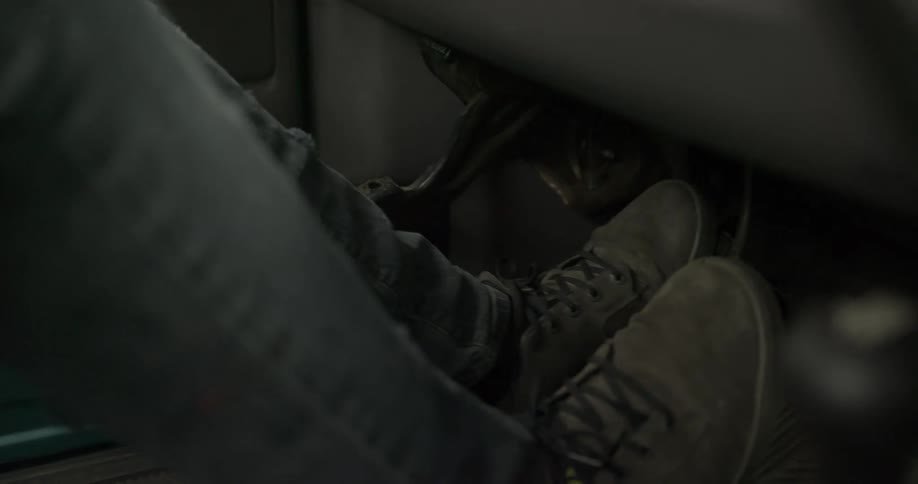 A man shifting as he drives