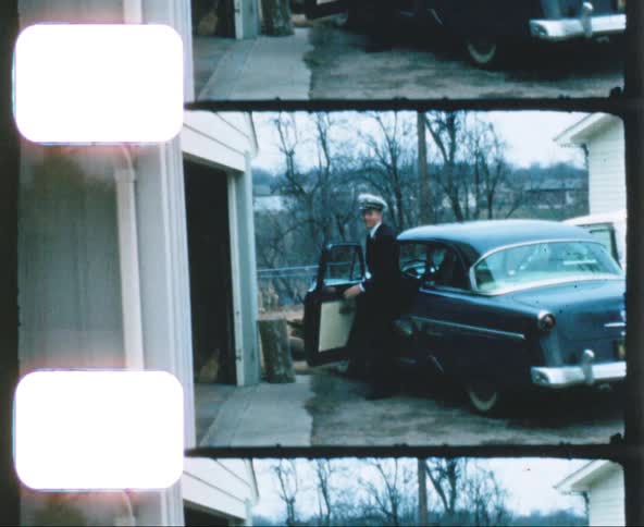 A military officer arrives at a house in a car