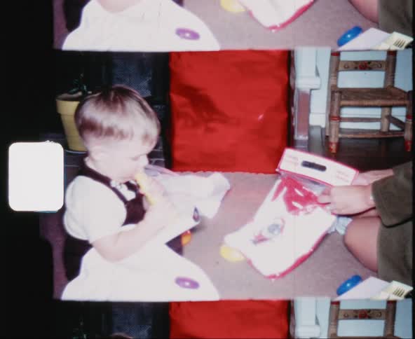Two children look at items with their mother