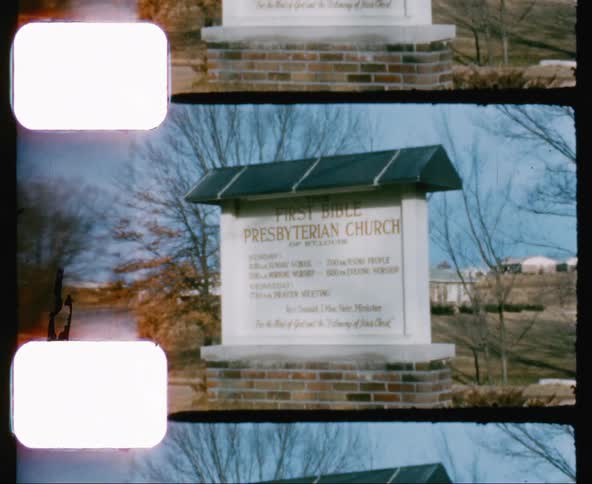 A sign for a church sits outdoors