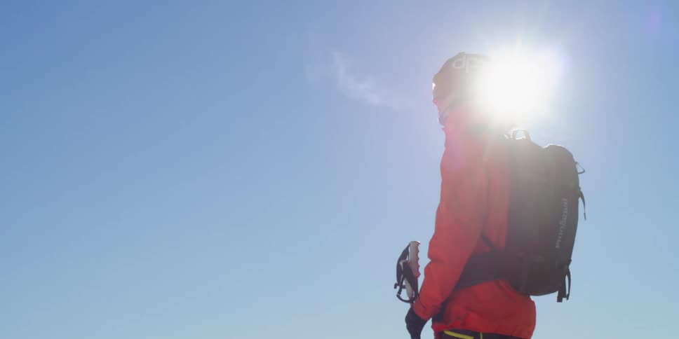 A skier stands in the cold