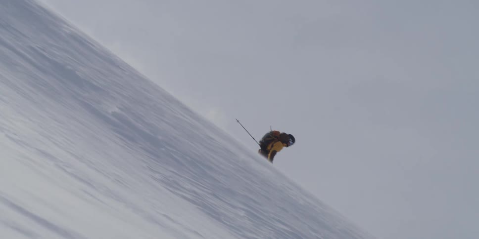 A person skis down a hill