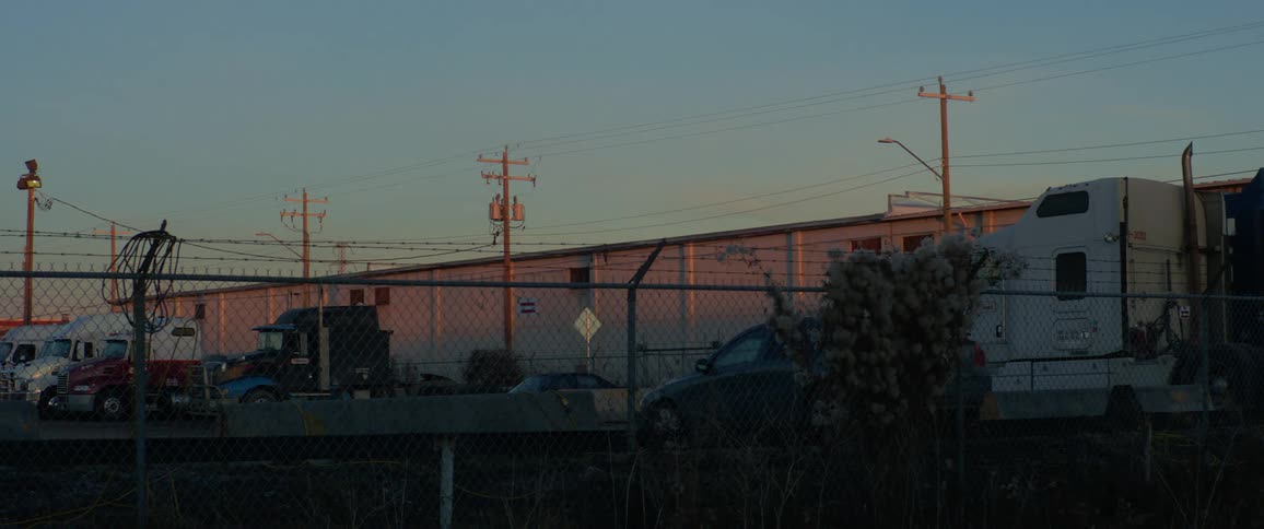 Trucks parked at a warehouse building