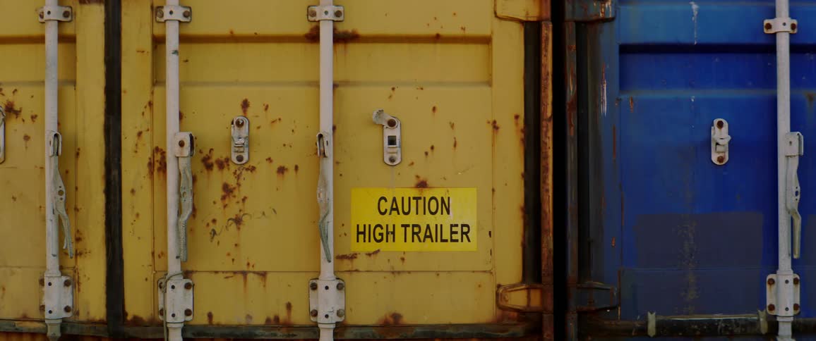 Rusted blue and yellow shipping containers
