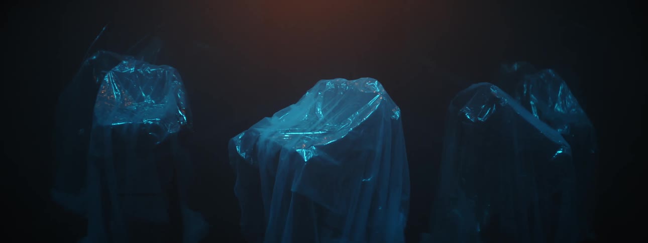 Objects under plastic wrap in dark