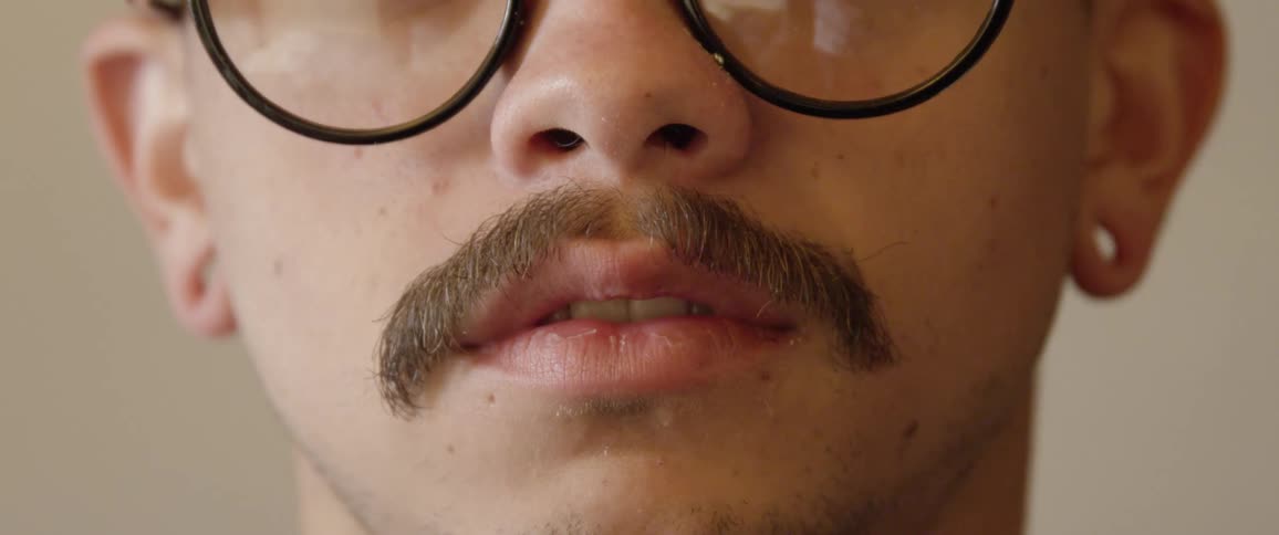 Man combs mustache
