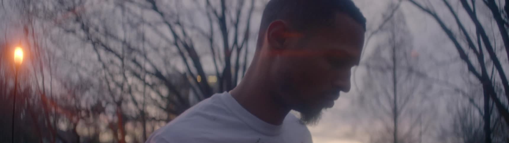 A young man walks outside