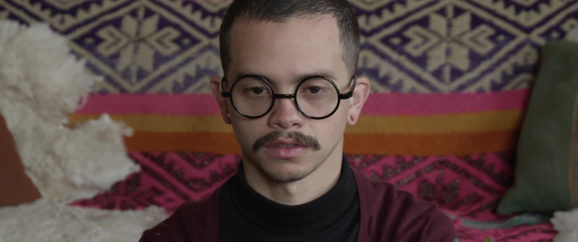 Man uses an old typewriter at home
