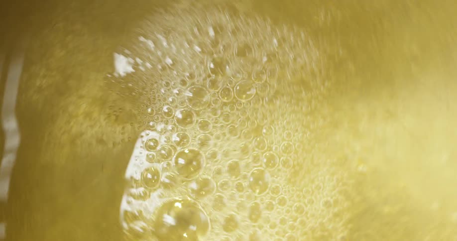 A liquid being stirred by a spoon