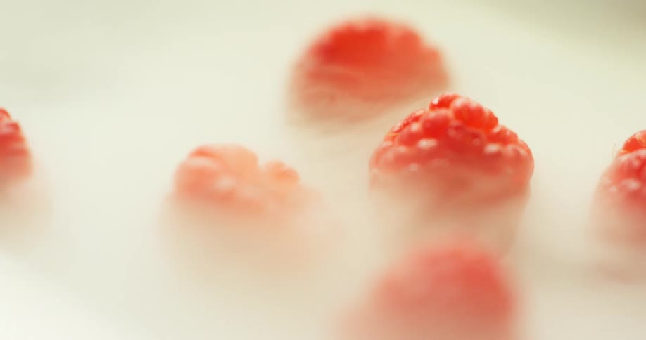 Raspberries engulfed in smoke
