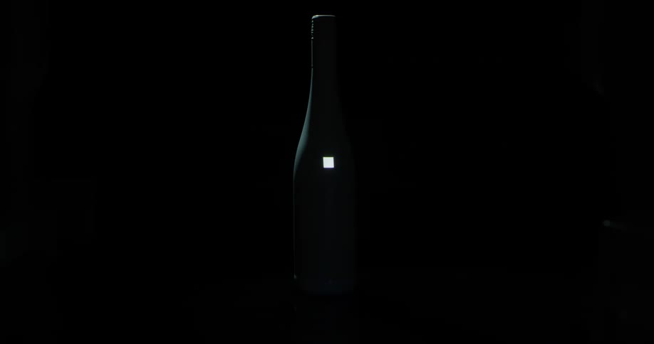 A bottle with a screen lighting up on it