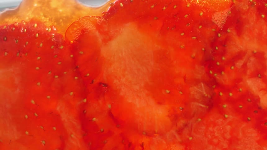 Close up of strawberries being squished