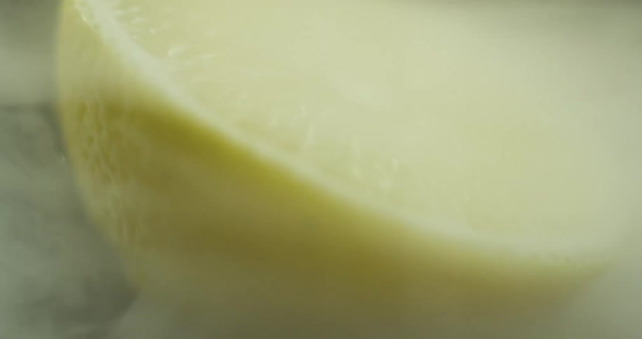 Swirling smoke around a lemon wedge blows away