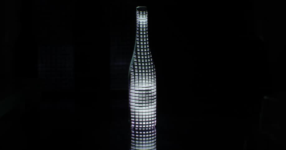 A grid projected on a white bottle