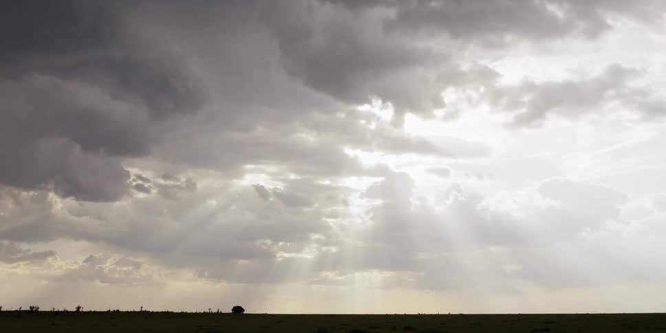 The sun shines through the clouds