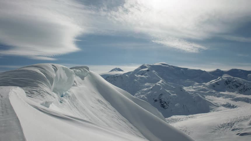 Time lapse of snow covered mountains in daytime