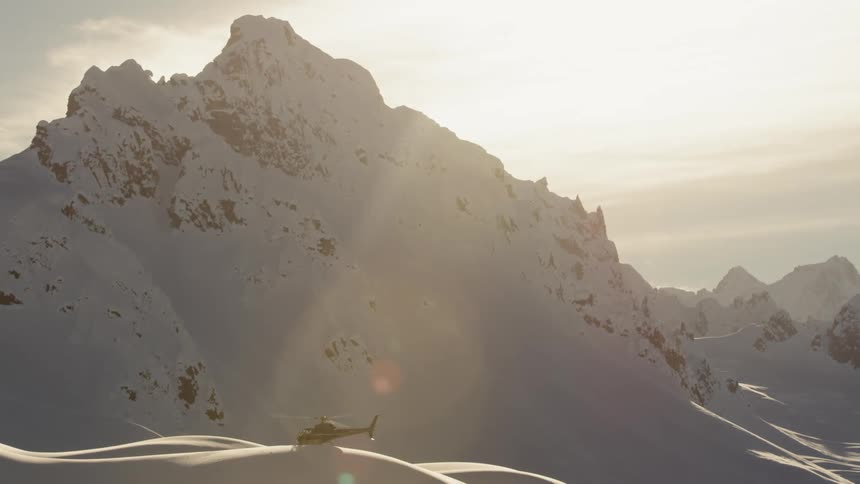 A helicopter is flying near a mountain range