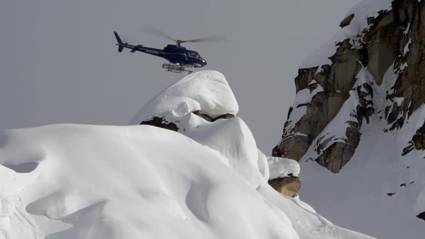 A helicopter over a mountain