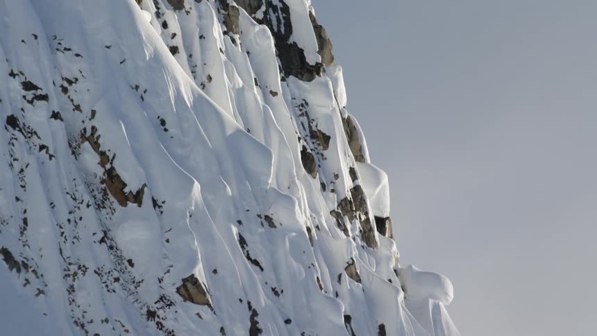 Snow covered mountain peak at day